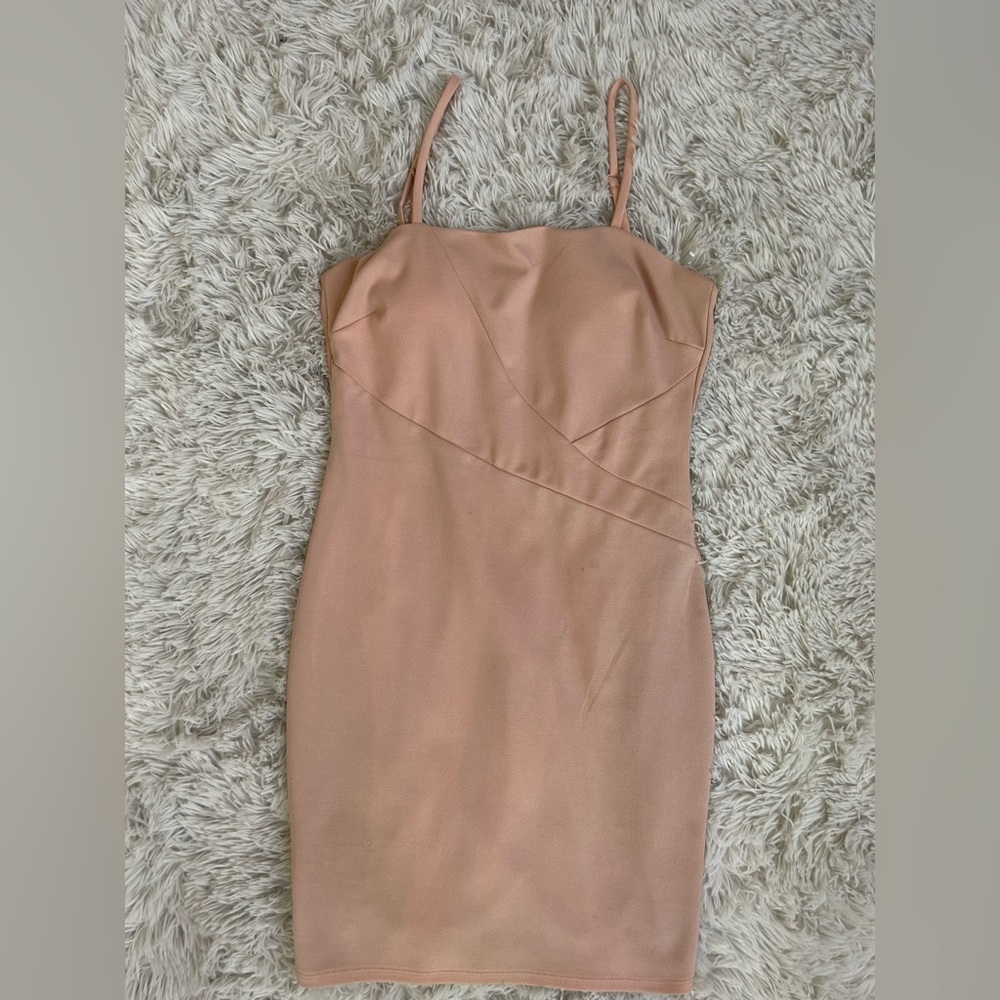 Short blush pink dress with padding.